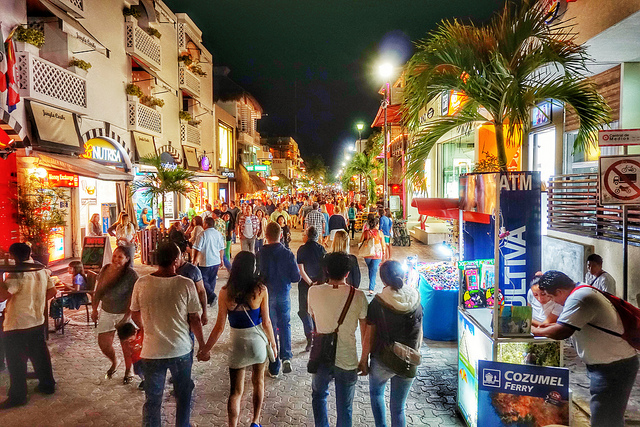 people walking on the fifth avenue in Playa del Carmen at night